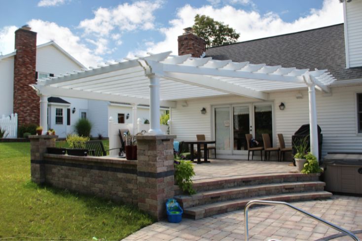 Stone Patio with Pergola Attached to the Home