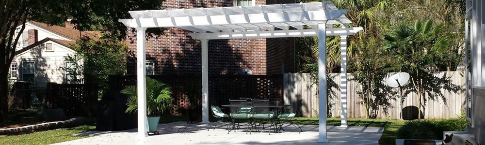 white custom-built pergola in backyard